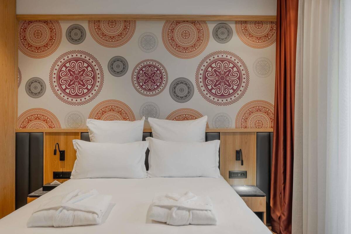Suite, 1 dormitori, terrassa | Caixa forta a l'habitació, escriptori i habitacions insonoritzades