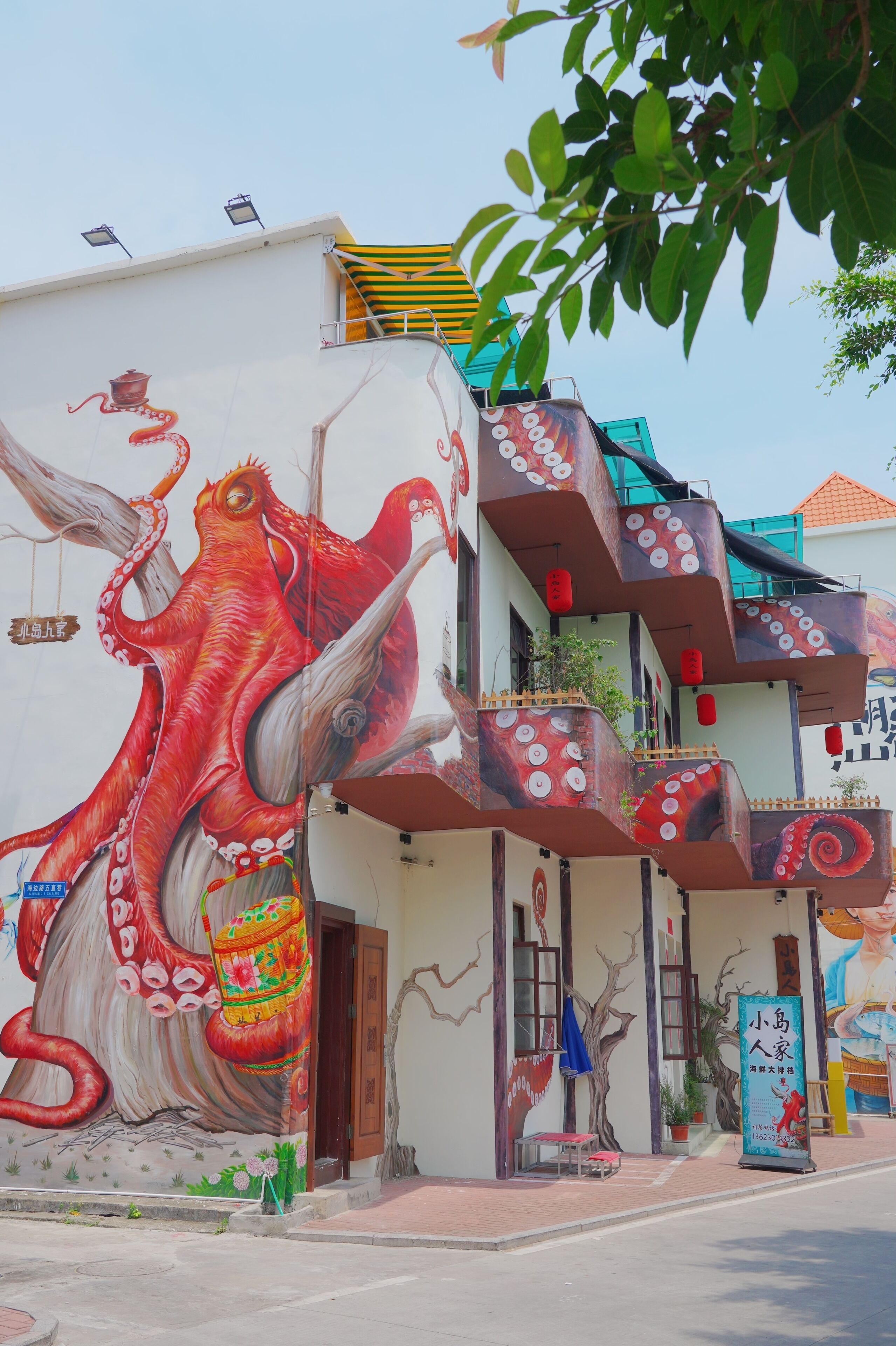 A building with a mural of a large octopus on the side.
