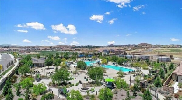 Relax by the resort's large, curved pool surrounded by lush gardens and mountain views.