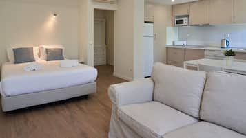 Deluxe Studio | Living area | 20-inch flat-screen TV with cable channels