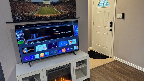 A flat-screen TV mounted on a white entertainment unit with a fireplace below it. - Round Rock Supernova minutes from Kalahari, Round Rock Sports Complex, and DT  (Round Rock)
