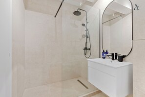 Executive Apartment | Bathroom | Hair dryer, bathrobes, towels