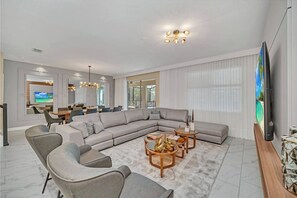 Family House | Living area | LCD TV - Storey Lake 9 BR Themed Games Room (Kissimmee)