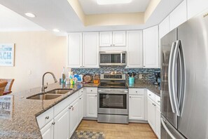 Coffee/tea maker, fridge, microwave, oven
