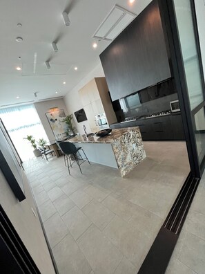 Enjoy cooking in this well-equipped kitchen with a central island and oven.