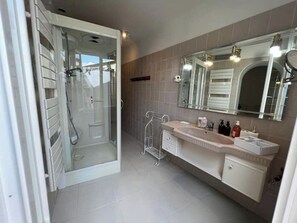 Shower, hair dryer, towels, soap