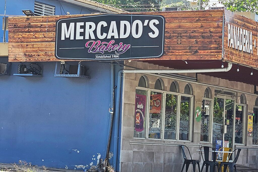 A storefront with a sign reading "Mercado's Bakery" established in 1984.