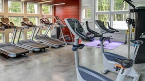 A gym with treadmills, elliptical machines, and a stationary bike. - Waterford, CT - Beautifully furnished 1Bedroom/1Bath 864sf Apartment (Waterford)