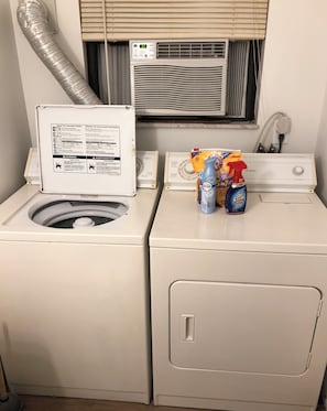 Convenient laundry facilities feature a front-loading washer and dryer.