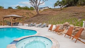 A swimming pool with lounge chairs and a gazebo. - Fallbrook's Finest Hideaway House - Pool, Game Rm (Fallbrook)