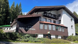 A two-story building with a sign reading "HOTEL BOHEMIA." - Hotel Bohemia (Zelezna Ruda)