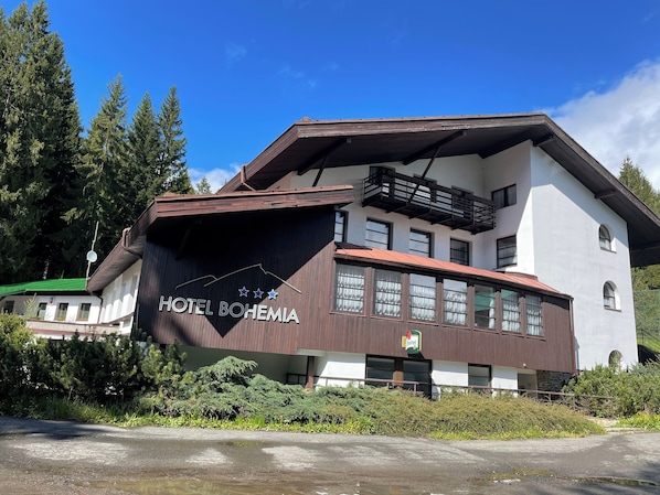 A two-story building with a sign reading "HOTEL BOHEMIA." - Hotel Bohemia (Zelezna Ruda)
