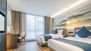 A hotel room with two beds, a desk, a chair, a TV, and a painting of a beach scene. - Rezen Dong Hotel (Shanghai)