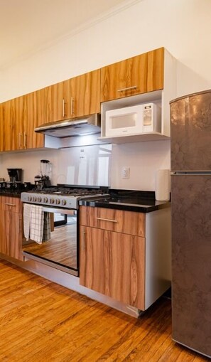 Fridge, microwave, stovetop, coffee/tea maker