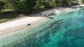 On the beach, sun loungers, beach towels