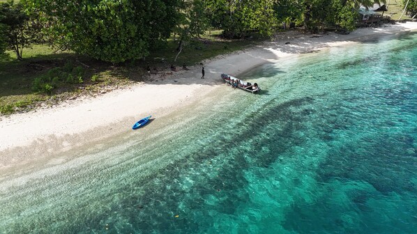 On the beach, sun loungers, beach towels