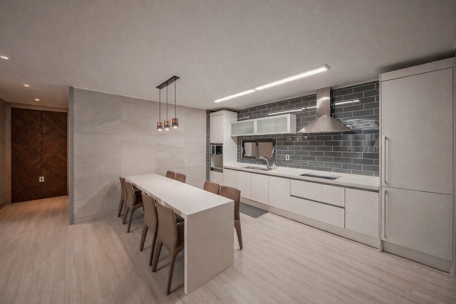 A modern kitchen with a central island, built-in appliances, and a minimalist design.