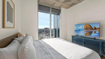 1 bedroom, desk, iron/ironing board, travel crib