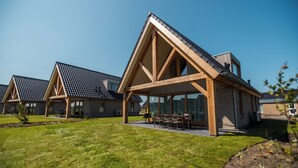 A modern building with a triangular roof and large windows. - EuroParcs Cadzand (Cadzand-Bad)