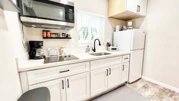 Fridge, microwave, stovetop, coffee/tea maker