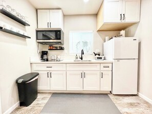 Fridge, microwave, stovetop, coffee/tea maker