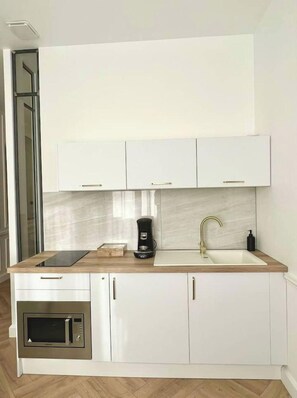 Fridge, microwave, stovetop, coffee/tea maker