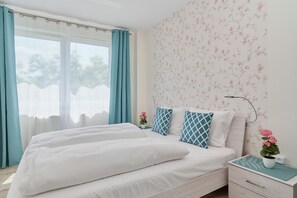 2 dormitorios, tabla de planchar con plancha, wifi y ropa de cama