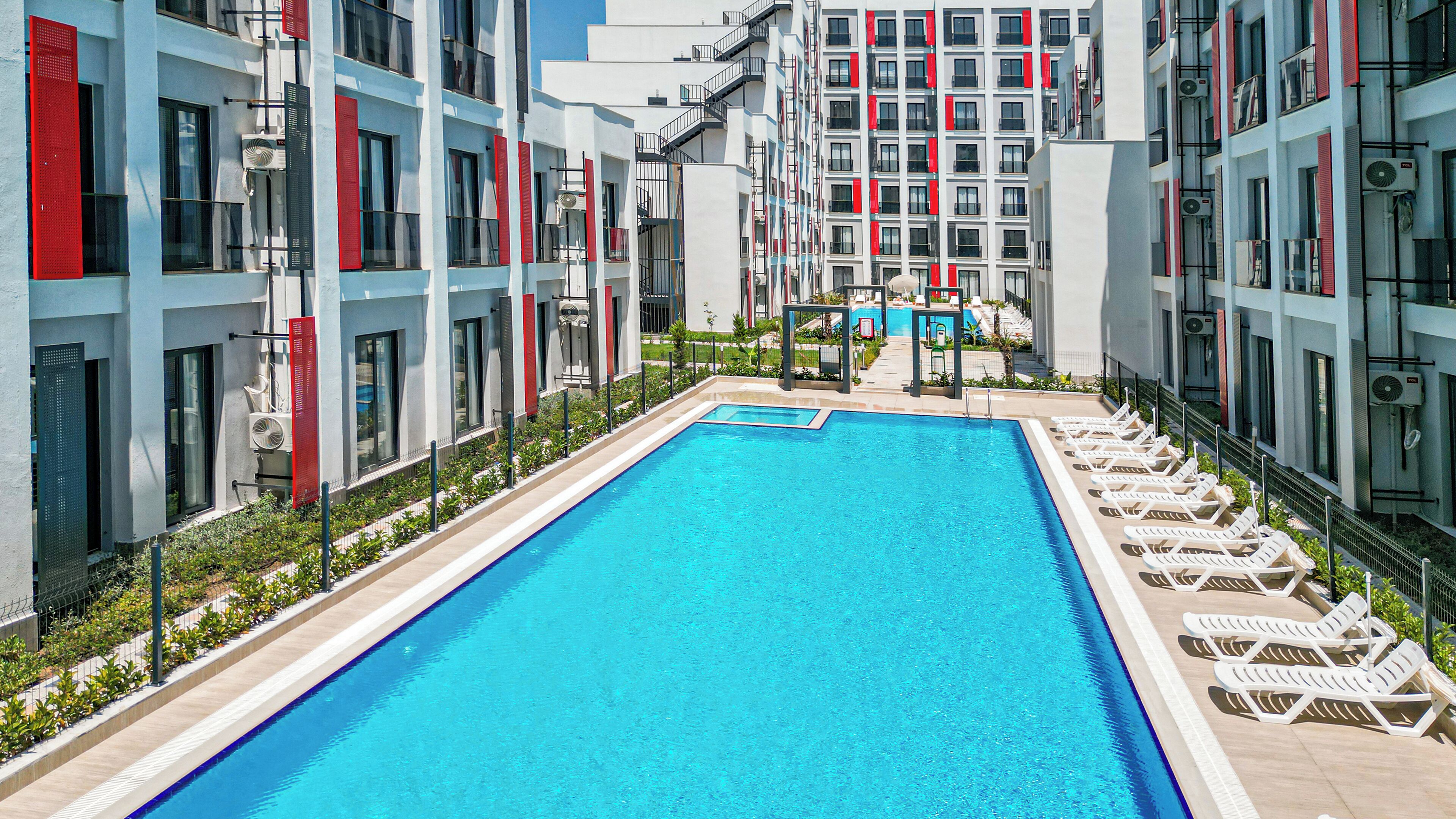 Seasonal outdoor pool, open 8:30 AM to 8:00 PM, pool umbrellas