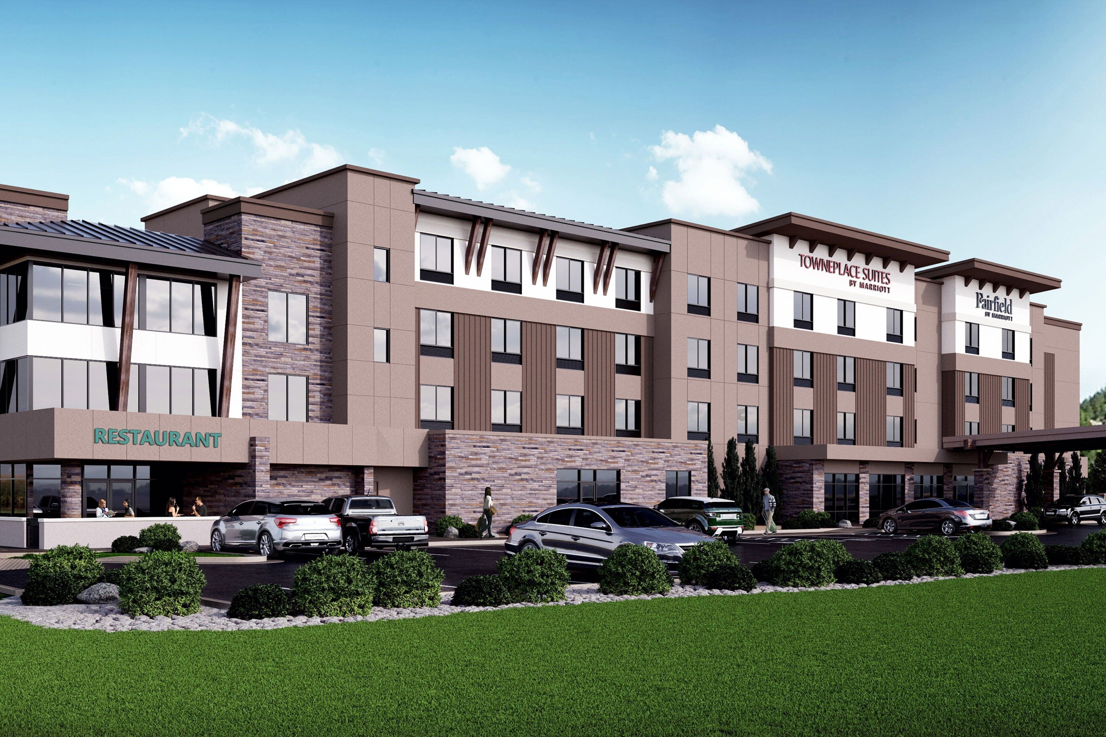 A hotel with multiple floors, a restaurant on the ground floor, and a parking area.