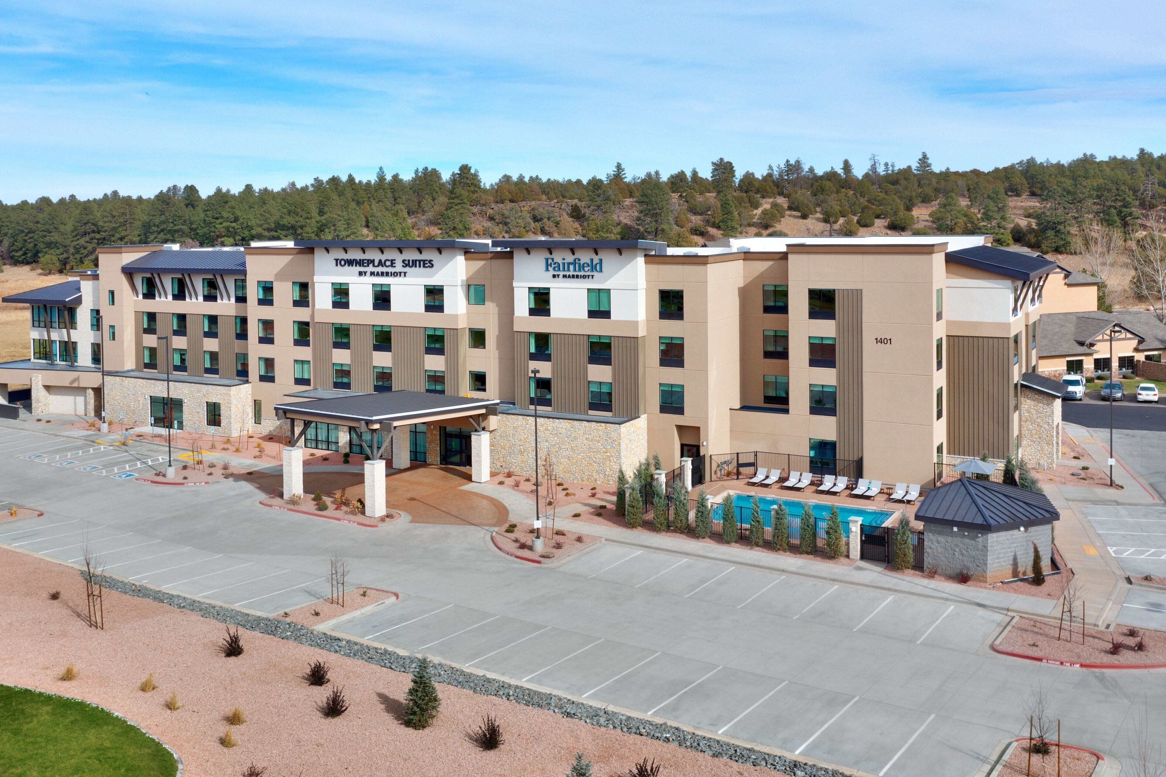 A hotel with multiple suites and a pool area.