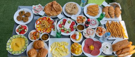 A table with various food items including bread, eggs, and vegetables.
