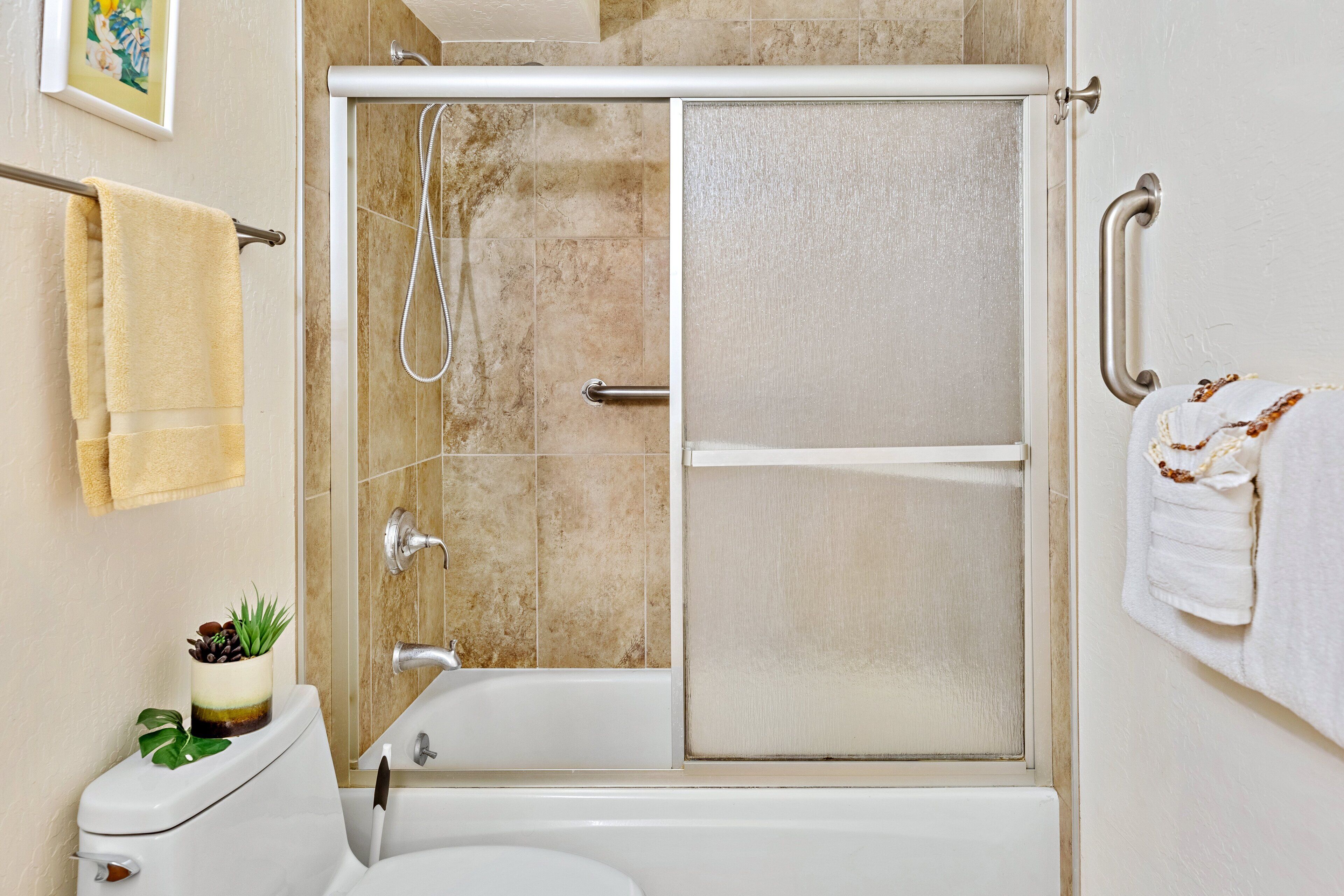 Bathtub, hair dryer, towels, soap