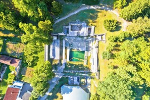 An aerial view of a historic building with a central courtyard, surrounded by dense greenery. - Hedonia Estate /w Sauna and Jacuzzi Near Varazdin (Petrijanec)