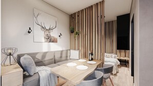 A modern dining area with a wooden table set for four, a sofa, and a wall-mounted TV. - EuroParcs Ossiacher See (Ossiach)