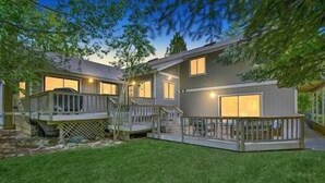 A two-story house with a deck and a staircase leading to the upper level. - 1 Mile to Summit or Village*Spa/Arcades/Pool Table (Big Bear Lake)