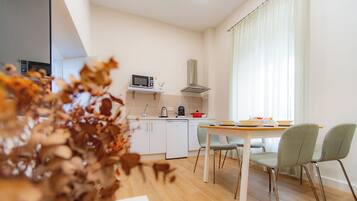 Superior appartement | Woonruimte | Een flatscreentelevisie