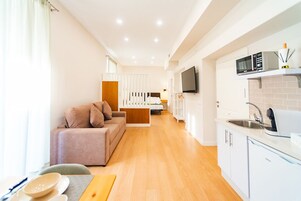 Superior Apartment | Living area | Flat-screen TV