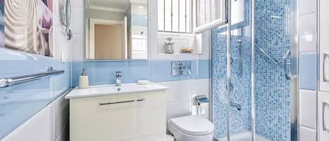 Shower, hair dryer, towels, soap