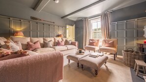 A cozy living room with a sofa set, a chair, and a coffee table. - Old Mill House, Brancaster, Norfolk (Brancaster)