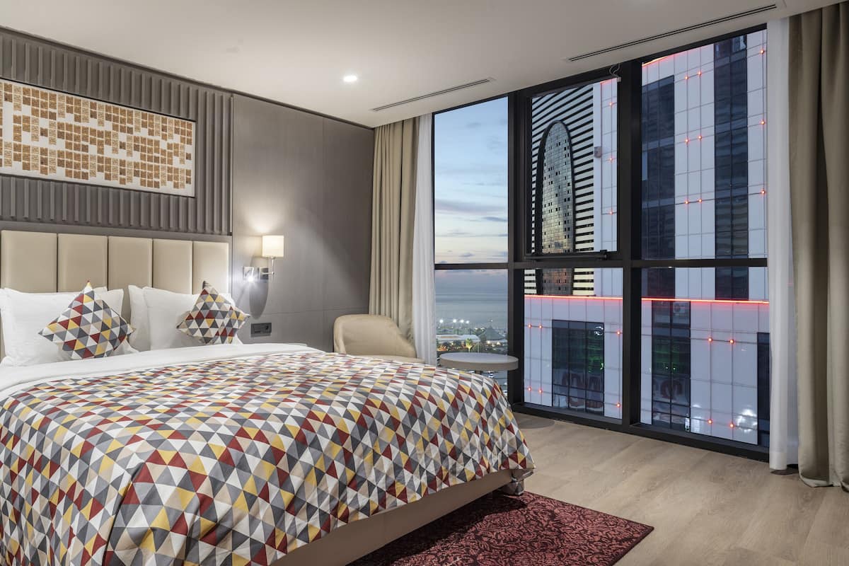 Executive Suite, 1 King Bed, Sea View | Minibar, in-room safe, desk, blackout drapes
