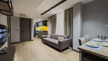 Comfort Suite | Living area | 82-cm Smart TV with satellite channels