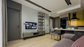 City Suite, Garden View | Living area | 82-cm Smart TV with satellite channels