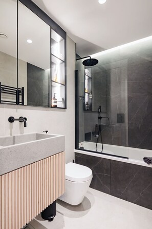 Bathtub, hair dryer, towels