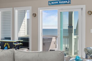 A room with a view of the beach, a pool table, and a sign reading "BEACH BADGER". - Beach Badger #147 - Rate Reduction! Ocean View Private Hot Tub, Dog Friendly! (North Topsail Beach)
