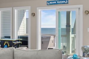 A room with a view of the beach, a pool table, and a sign reading "BEACH BADGER". - Beach Badger #147 - Rate Reduction! Ocean View Private Hot Tub, Dog Friendly! (North Topsail Beach)