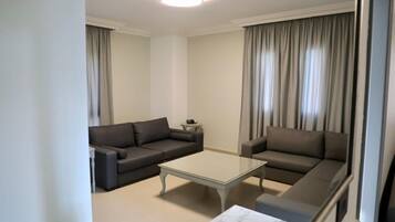 Family Suite, City View | Living area | 52-inch LED TV with cable channels, Netflix, streaming services