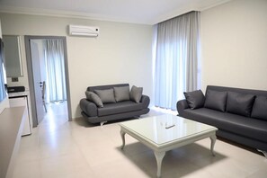 Family Suite, City View | Living area | 52-inch LED TV with cable channels, Netflix, streaming services