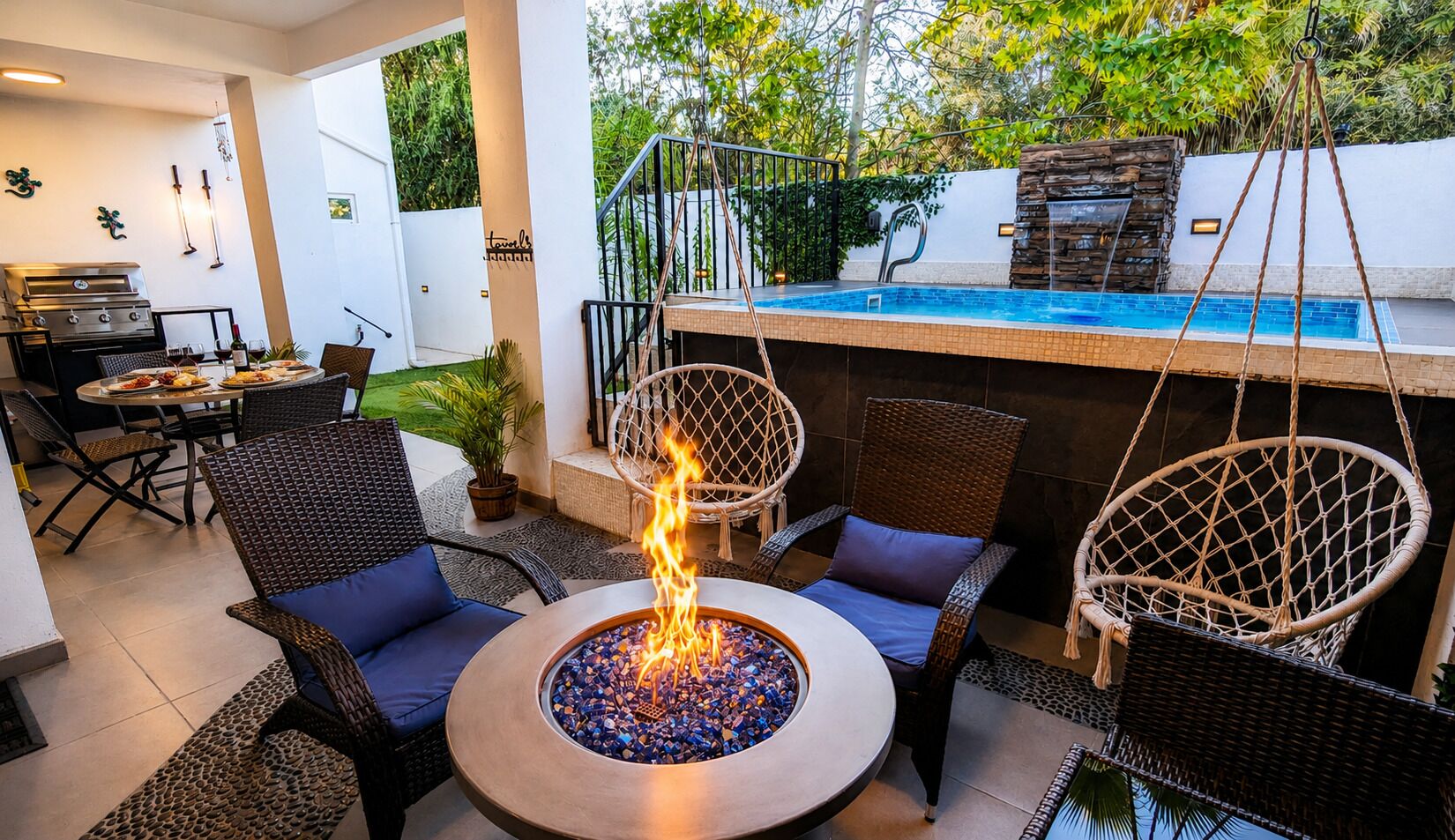 A patio with a fire pit, wicker furniture, and a pool.