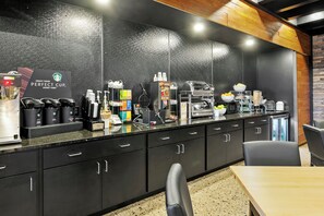 A modern kitchen area with a coffee station, including a coffee machine, grinders, and a sign that reads "Craft Your Perfect Cup Every Time." - Cobblestone Hotel & Suites - Wickenburg (Wickenburg)