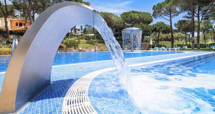 Apartement 4 building parts spread over a pine plot